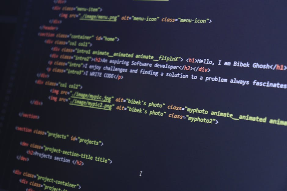 A close-up photograph of a computer screen displaying lines of HTML and CSS code in a dark-themed text editor. The code includes tags such as <html>, <head>, <title>, and <link>, with syntax in variou